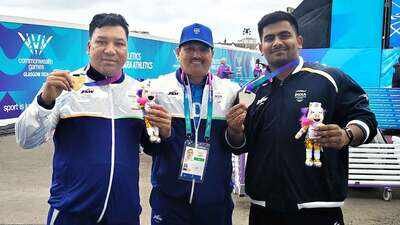 (From left) Soman Rana with coach Rakesh Singh Rawat and Shubham Juyal in Glasgow on Saturday Land mine blast survivor Soman Rana scripts golden CWG story with para shot put title