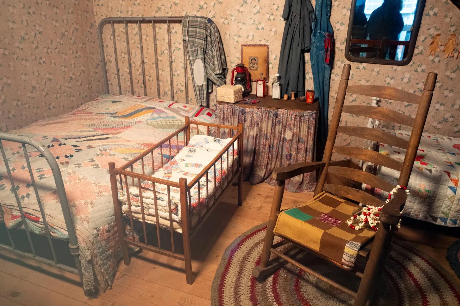The tiny bedroom held several beds and a baby’s crib, reflecting the crowded cabin where Dolly grew up with her 11 siblings.