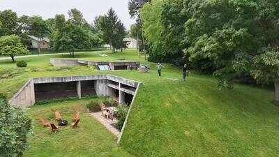 Built for $70,000 in 1976, this underground Missouri concrete home survived a deadly F4 tornado; 50 years later, it remains almost invisible from the road, hidden beneath a hillside