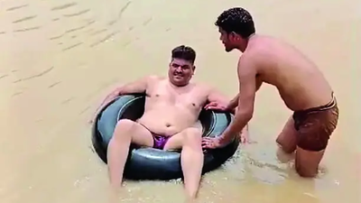 A video showing a teacher using an inflated tyre tube to cross the swollen river has gone viral on social media TOI Impact: Flood-hit teachers to get alternative classrooms