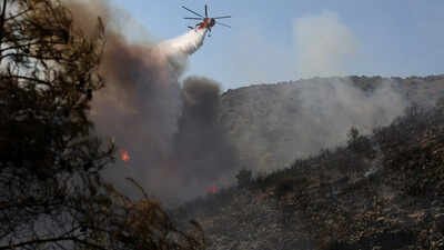 Two people have died in fires that broke out simultaneously Sunday on the island of Salamis near Athens, the local fire department said. (Photo: @CGTNOfficial) Europe wildfires: 2 dead, 500 evacuated as twin blazes hit Greek island near Athens