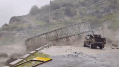Bridge damaged after Tamak drain overflows in Chamoli On camera: Swollen river sweeps away bridge after flash flood in Uttarakhand's Chamoli