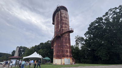 Officials and parks supporters gather for a ceremony on Aug. 31, 2026. In 1937, Pittsburgh built a 102-foot water tank that doubled as a park lookout; closed for decades, it is getting a $3 million restoration to reopen its 154-step climb and skyline view