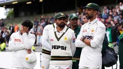 Pakistan's Babar Azam, center, with teammates following his side's defeat to England at Edgbaston. (AP Photo) Pakistan’s England nightmare deepens: 11 WTC points docked, 50% match fee fine — here’s why