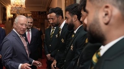 Britain's King Charles III speaks with members of the Pakistan National Cricket Team. (AFP) Britain's King Charles III speaks with members of the Pakistan National Cricket Team. (AFP)