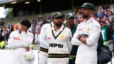 Pakistan's Babar Azam, center, with teammates following his side's defeat to England on day four of the third cricket Test at Edgbaston, (Mike Egerton/PA via AP) Pakistan's Babar Azam, center, with teammates following his side's defeat to England on day four of the third cricket Test at Edgbaston, (Mike Egerton/PA via AP)