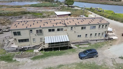 A California hunting club established more than 100 years ago is selling its 400-acre private-island property for $1.5 million; the marsh retreat includes a 5,000-sq-ft clubhouse with 19 bedrooms