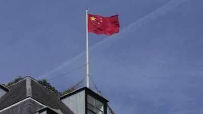A Chinese national flag is raised at the Chinese embassy in London. (AP Photo) UK warns universities to cut ties with China-linked firm after MI5 flags AI, cyber research espionage