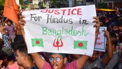 The dead body of a man, with a Mymensingh Hindu Cooperative Credit Union Limited token was found floating inside a drum near a sluice gate. (Representative image of protests demanding justice for Hindus) Bangladesh jewellery shop owner's body found inside floating drum; Hindu credit union token in pocket