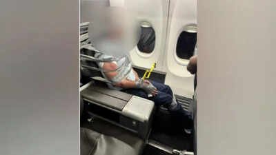 A photo shared by one of the passengers, Richard Olenick, showed the man had multiple loops of tape around his wrists, torso and head US man duct-taped to seat after attacking passenger mid-flight, hurling racial abuse