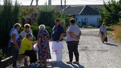 Local residents gather at a mobile polling station during early voting in Russia's parliamentary election Russia kicks off voting in first parliamentary election since Ukraine war began