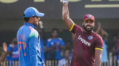 West Indies John Campbell, right, celebrates his century during the second One Day International (ODI) cricket match between India and West Indies, in Guwahati. (PTI Photo) John Campbell scripts history vs India, eclipses Chris Gayle and Powell with 65-ball century