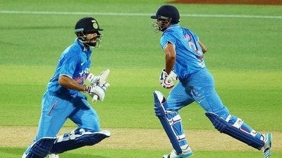 Virat Kohli, and the batter in question run between the wickets (AFP) Virat Kohli, and the batter in question run between the wickets (AFP)