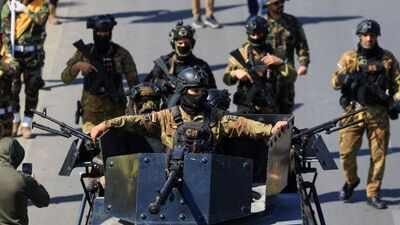 Members of the Iraqi armed group Kataib Hezbollah attend the funeral of their members (Reuters) Iraq caught between US withdrawal and Iran-backed militias as disarmament deadline looms