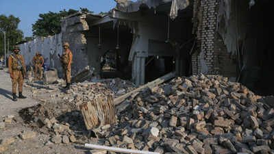 Army soldiers examine the site following a powerful bomb exploded at a mosque in Kohat (AP photo) Death toll mounts to 31 in suicide blast at Pakistan police compound, several still critical