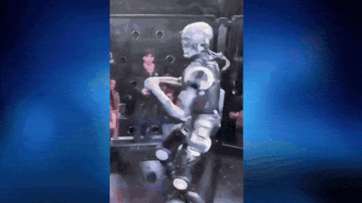 Humanoid robot lands punishing kicks on influencer. Video: REK Robot vs human: Humanoid robot throws punches, kicks influencer across cage - video