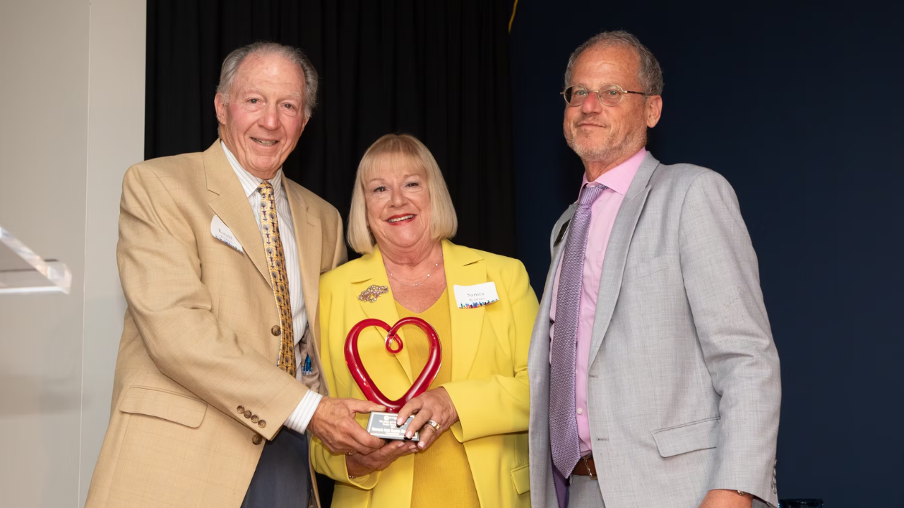 Ronald and Samra Robbins, founders of Backpack Buddies of Metro Atlanta, receive the Max &amp; Mary London People Power Award from Jewish Federation of Greater Atlanta President &amp; CEO Eric Robbins.
