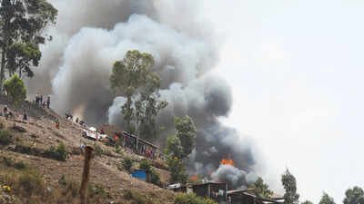 Congolese civilians gather as they attempt to extinguish fire at a school and neighbouring settlement in the area controlled by Rwanda-backed AFC/M23 rebels since the group staged an offensive in eastern Congo in February 2025, in Bukavu, Democratic Republic of Congo, September 10, 2026. (Reuters image) At least 24 schoolchildren killed after fire engulfs schools in rebel-controlled Congo