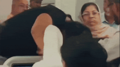 The fight continued until cabin crew members and other passengers intervened and managed to separate the two men Watch: T-shirt torn, fists fly as passengers clash mid-air on Bangladesh flight