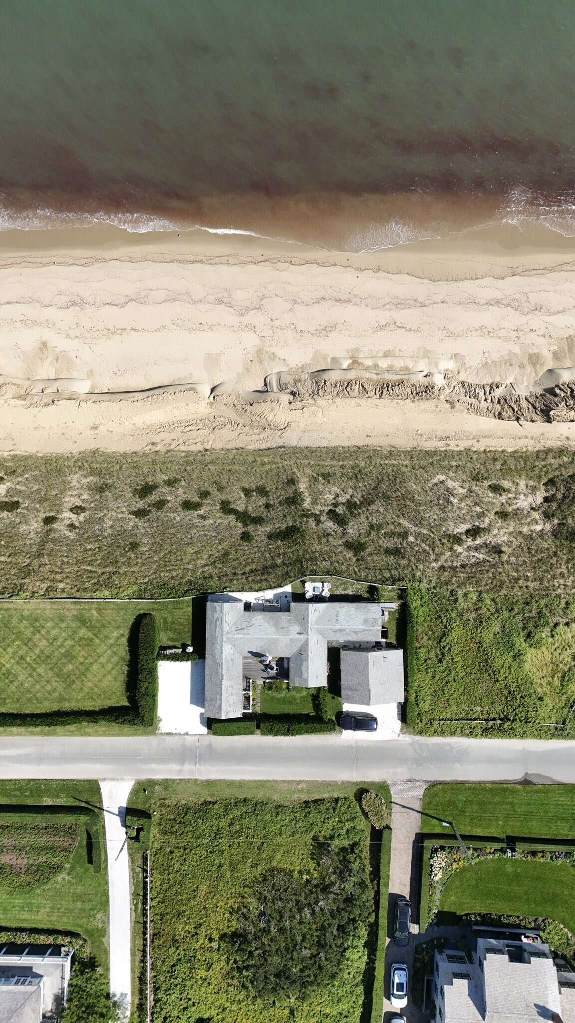 The cottage at 93 Baxter Road once had far more land between the house and the edge of the bluff.