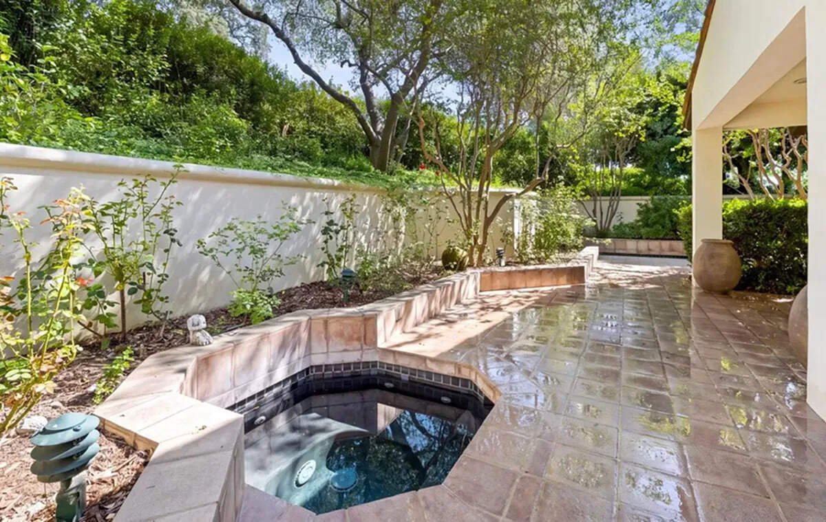 The mansion’s wellness oasis features a cold plunge pool and hot tub, offering a luxurious space to unwind and relax.