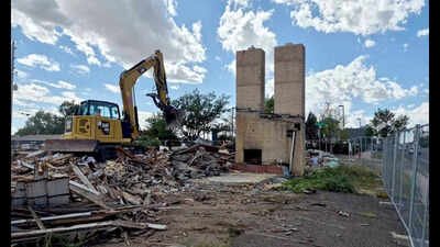 The twin chimneys were saved until the end of the demolition. Cheyenne's Twin Chimneys motor court stood for almost 90 years; this week its landmark chimneys fell in about 30 seconds to make way for a drive-thru coffee shop