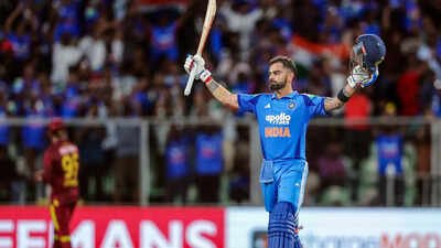 India's Virat Kohli celebrates his century during the 1st ODI against West Indies. (ANI Photo) ‘If he thinks about 100 centuries’: Ajinkya Rahane reveals if Virat Kohli can reach the milestone