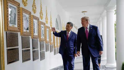 US President Donald Trump and Chinese President Xi Jinping look at an image of an autopen signing former US President Joe Biden's signature at the "Presidential Walk of Fame" in the Colonnade of the White House in Washington. Reuters photo. ‘This is the autopen’: Trump mocks Biden while showing Xi presidential portraits