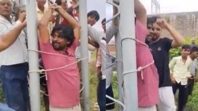 Villagers held a mobile tower technician captive for two hours in Fatehpur district Watch: Fed up over poor network, villagers tie technician with mobile tower