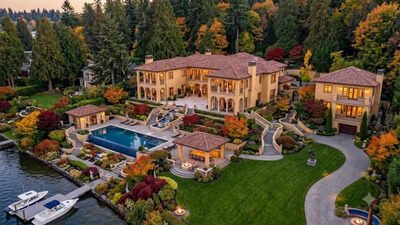 Representative image generated using AI Washington couple spent nearly two decades and $50 million creating a resort-style retreat on 2.3 acres of Lake Washington; the two-home waterfront compound now asks $71 million