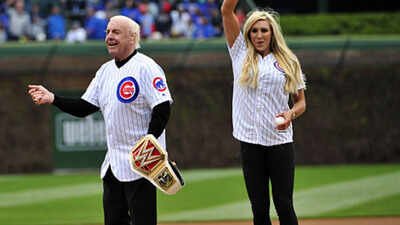 Former WWE champion Ric Flair and current women's champion Charlotte Flair throw out the ceremonial first pitch before the game between the Chicago Cubs and the Atlanta Braves on May 1, 2016 at Wrigley Field in Chicago, Illinois. (Photo by David Banks/Getty Images) Charlotte Flair and Ric Flair’s father-daughter bond: From wrestling legacy and childhood struggles to mutual support, family tragedy and a lasting WWE connection