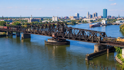 Representative Image (AI-generated) Toledo’s 1897 railroad swing bridge was bought for $1 in 2004; a new $65 million overhaul will replace nine fixed spans and reinforce the movable section to carry heavier 286,000-pound railcars