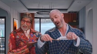 Amitabh Bachchan and Benedict Garrett in a 2022 ad for Dabur Lal.