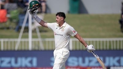 Australia's Matt Renshaw raises his helmet to celebrate his 150 runs on day two. (AFP)