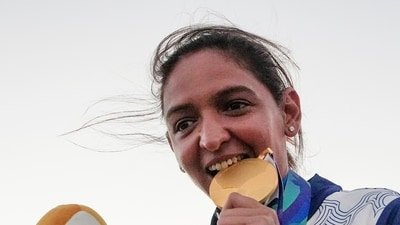 India's captain Harmanpreet Kaur poses for photographs with Gold medal after winning the women's final T20I cricket match between India and Sri Lanka (PTI) India's captain Harmanpreet Kaur poses for photographs with Gold medal after winning the women's final T20I cricket match between India and Sri Lanka (PTI)
