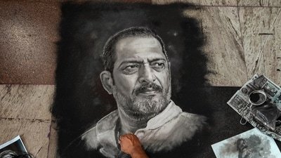 Rangoli artist Shreehari Pavale works on a rangoli portrait paying tribute to veteran actor Nana Patekar, in Vashi, Navi Mumbai, Thursday, Oct. 8, 2026. (PTI)