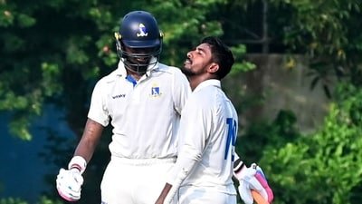 Bengal's Sudip Gharami celebrates his half century as Abishek Porel, left, looks on during the 2nd day of the Ranji Trophy cricket match between Bengal and Delhi (PTI)