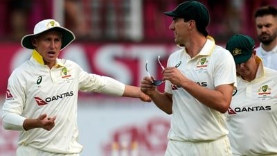 Australia's Pat Cummins, center, with his teammates leave the field as play is stopped due to bad light on day two of the first Test match between South Africa and Australia. (AP Photo/Themba Hadebe) Australia's Pat Cummins, center, with his teammates leave the field as play is stopped due to bad light on day two of the first Test match between South Africa and Australia. (AP Photo/Themba Hadebe)