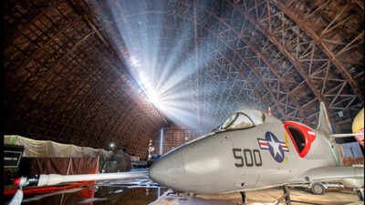 An 83-year-old Oregon blimp hangar was sold for $1 after a storm tore a 200-foot hole in its roof; after nearly 10 months shut, the air museum inside is now set to reopen on October 29