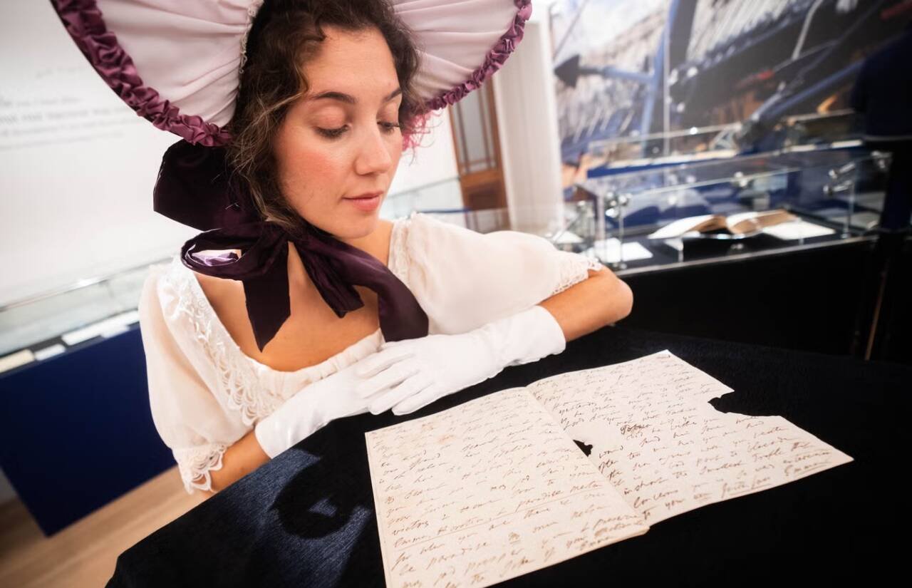 A woman reading letter written by Emma Hamilton's letter