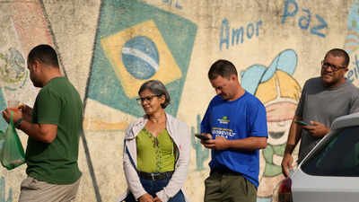 Brazil election: Lula, Flavio Bolsonaro head to runoff after tight first-round vote