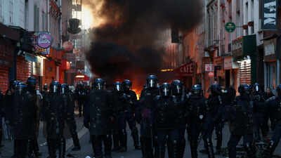Riot police operate during civil unrest, the day after a national day of demonstrations against the cost of living and rising fuel prices, in Paris, France (Reuters photo_ France unrest: PM orders curfews, hints at declaring emergency; over 2,400 arrested - top developments