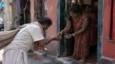 Collecting soil (AI-Generated) Sculptors visit Kolkata’s red-light area every year to ask sex workers for soil from their doorsteps; the powerful symbolism behind Bengal’s ‘punya mati’ tradition