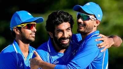 Jasprit Bumrah, centre, celebrates with Axar Patel, right, and Washington Sundar after taking the wicket of Sri Lanka's Sineth Jayawardena during the second semifinal between India and Sri Lanka, at the 20th Asian Games, in Nisshin, Japan. (PTI) Asian Games: India script history vs Sri Lanka, bowl out opposition for sub-50 total in T20Is for first time