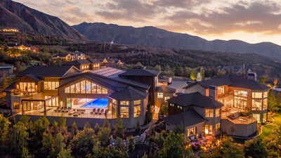 In 2017, YouTube star and real estate investor Kris Krohn commissioned a Utah estate; the 28,446-sq-ft compound is now listed for $13.95 million, featuring a hydraulic indoor pool that transforms into a column-free ballroom