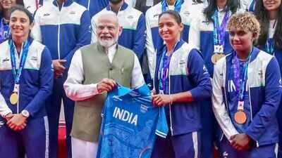 Prime Minister Narendra Modi is presented a jersey by Indian women's cricket team captain Harmanpreet Kaur during an interaction programme with the athletes of the Asian Games 2026, in New Delhi. (PTI Photo) 'Your success is not just yours': PM Modi meets Asian Games medal-winners, lauds India's sporting achievements