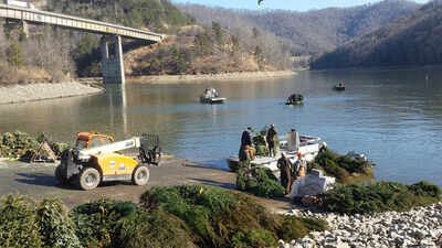 Natural materials can provide shelter for aquatic life (Kentucky Fish and Wildlife photo) Kentucky collected about 5,000 discarded Christmas trees in 2026 instead of sending them to landfills; officials sank 1,700 in a single lake to replace lost underwater shelter for fish