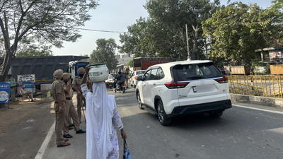 Policemen stationed on a road to Punjab's Mansa town. Punjab Bandh after activist Parminder Singh Jhota’s killing: Trucks on roadside, barricades on all roads to Mansa