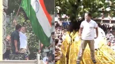 Rahul climbs barricades during INDIA bloc march to EC office Watch: Rahul Gandhi climbs barricades, waves Tricolour as cops stop INDIA bloc march against CEC