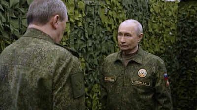 Russian President Vladimir Putin listens to a report of Russian chief of general staff general Valery Gerasimov (Russian Presidential Press Service via AP) Russia building 'security zone' in Ukraine that won't be part of future peace talks: Putin